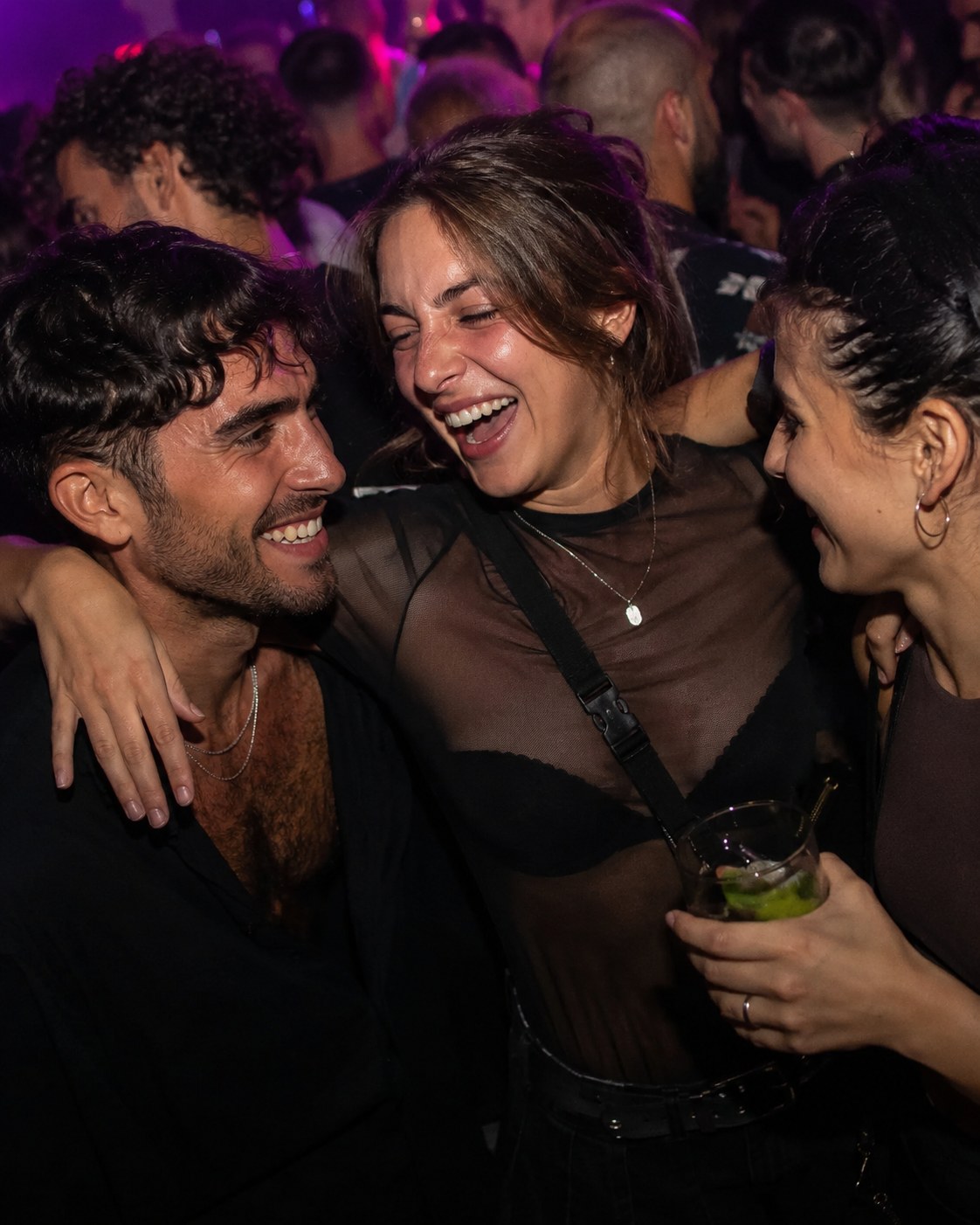 Friends laughing at a club